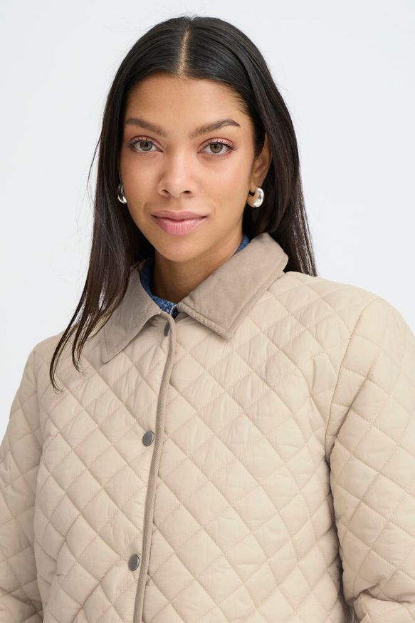 Detalle cuello abrigo acolchado beige comprar